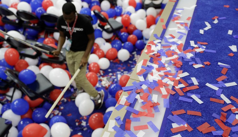 Confetti covers part of the stage as a worker begins to clean up following the final day of the Democratic National Convention, Friday, July 29, 2016, in Philadelphia. (AP Photo/John Locher)