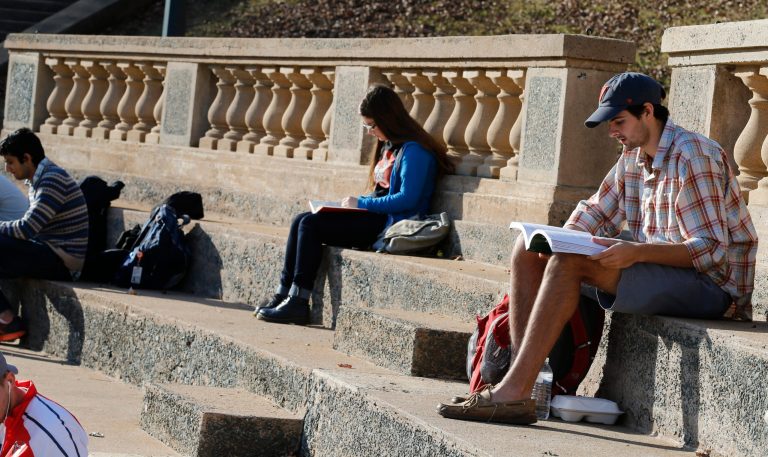 Students sit in an ampetheatre on the campus of the University of Virginia in Charlottesville, Va. (AP Photo/Steve Helber)