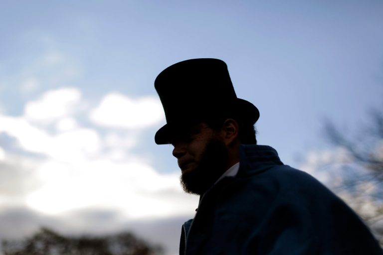 Bryce Stenzel of Mankato Minn., dressed as Abraham Lincoln, arrives before a ceremony commemorating the 150th anniversary of the dedication of the Soldiers' National Cemetery and President Abraham Lincoln'sÃÂ GettysburgÃÂ Address on Tuesday inÃÂ Gettysburg, Pa. (AP/Matt Rourke)