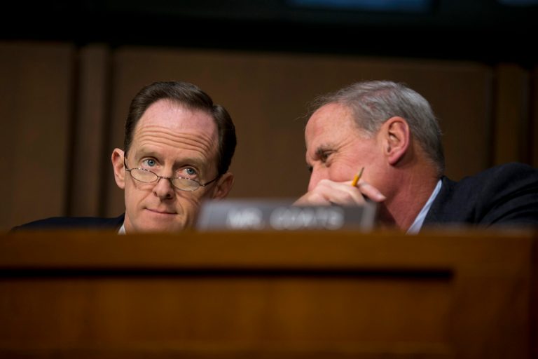   Joint Economic Committee members Sen. Pat Toomey, R-Pa., left, and Sen. Dan Coats, R-Ind. talk on Capitol Hill in Washington, Thursday, Dec. 6, 2012, during the committee's hearing entitled: 
