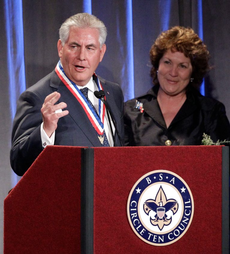 Rex Tillerson, President and CEO of Exxon Mobil Corporation makes a brief comment as his wife Renda, looks on after Tillerson was recognized by the Boy Scouts of America, Circle Ten Council during the Friends of Scouting Banquet Thursday, March 3, 2011, in Dallas. Secretary of Defense Robert M. Gates, a former eagle scout, was the keynote speaker at the event that raised $1 million. (AP Photo/Tony Gutierrez)