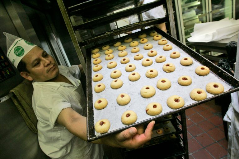 An employee at the Ferrara Bakery in New York's Little Italy displays a tray of raspberry drop cookies, Friday, June 27, 2008 in New York. New York's trans fat ban was the first to be adopted by an American city. (AP Photo/Mary Altaffer)