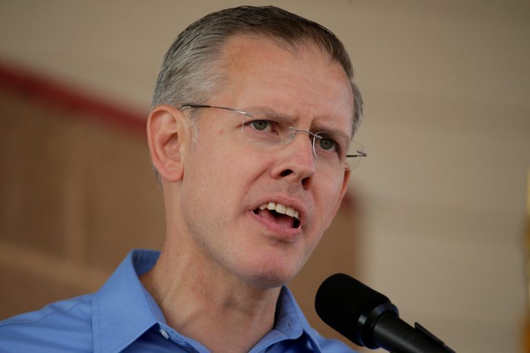 Paul Davis, a Democrat running for governor against Republican incumbent Sam Brownback, has broadened his lead in the race despiteÂ negative ads against him.Â (AP Photo/Charlie Riedel)