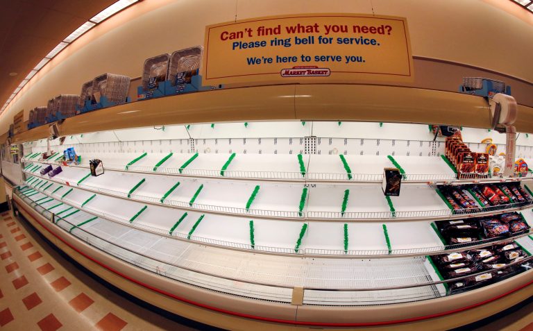 This photo made with a fisheye lens shows a sign atop mostly empty meat shelves at Market Basket in Haverhill, Mass., Monday, Aug. 18, 2014. As an employee revolt at the New England grocery store chain headed into its fifth week, the governors of Massachusetts and New Hampshire made the unusual move of personally stepping into negotiations aimed at ending a standoff threatening the future of the popular low-priced supermarkets. (AP Photo/Elise Amendola)