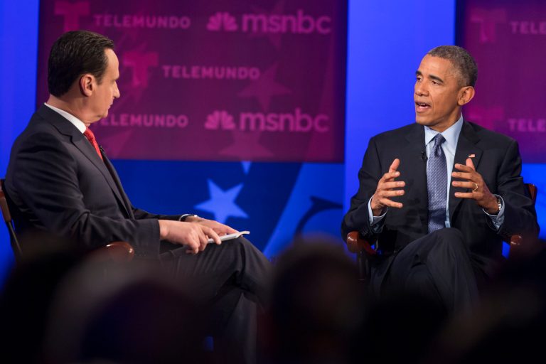 President Barack Obama gestures during a town hall meeting on immigration with Jose Diaz-Balart hosted by Telemundo and MSNBC, Wednesday, Feb. 25, 2015, at Florida International University in Miami. (AP Photo/Evan Vucci)