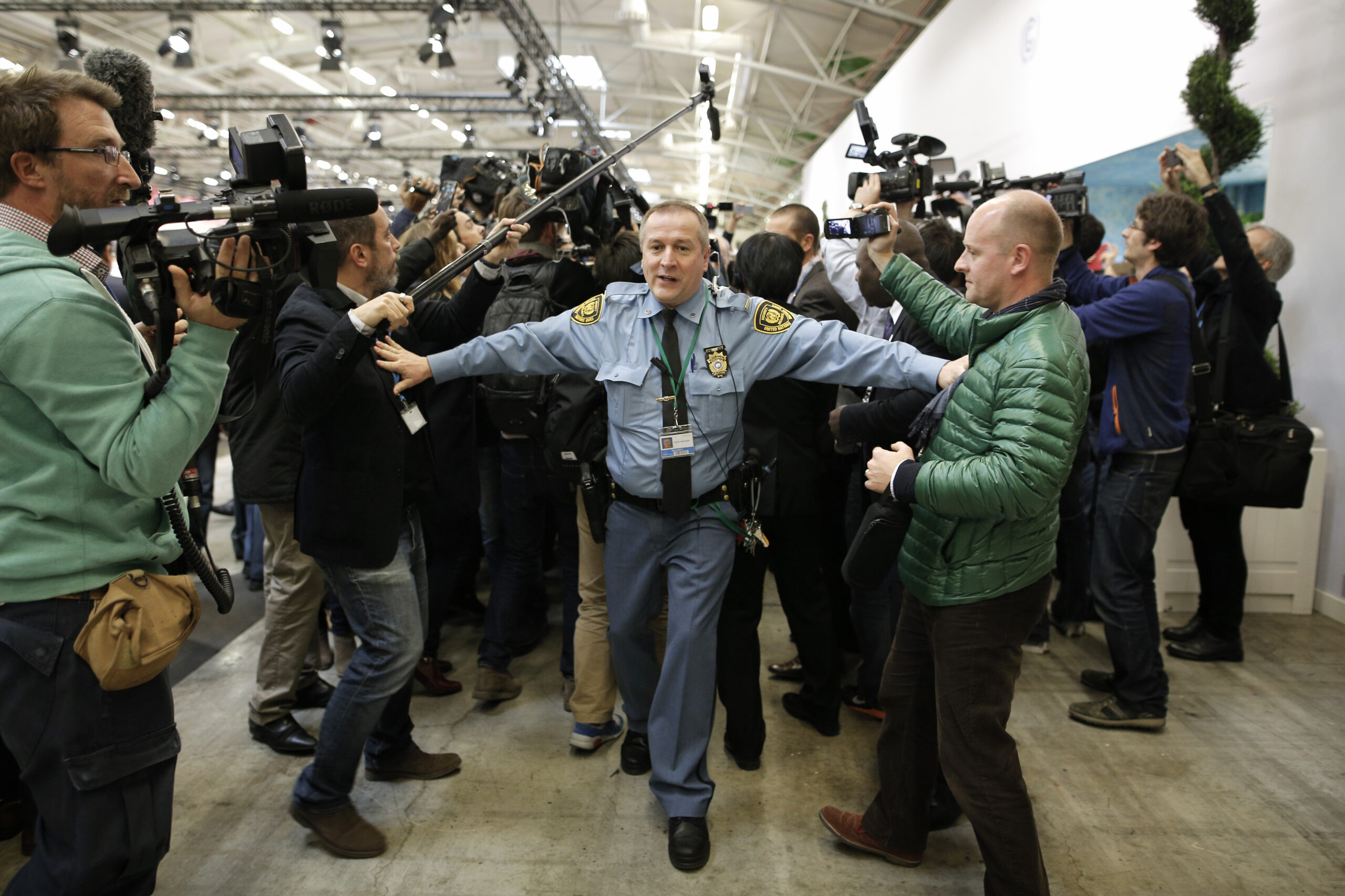 Reporters shout, jump for joy after climate change agreement