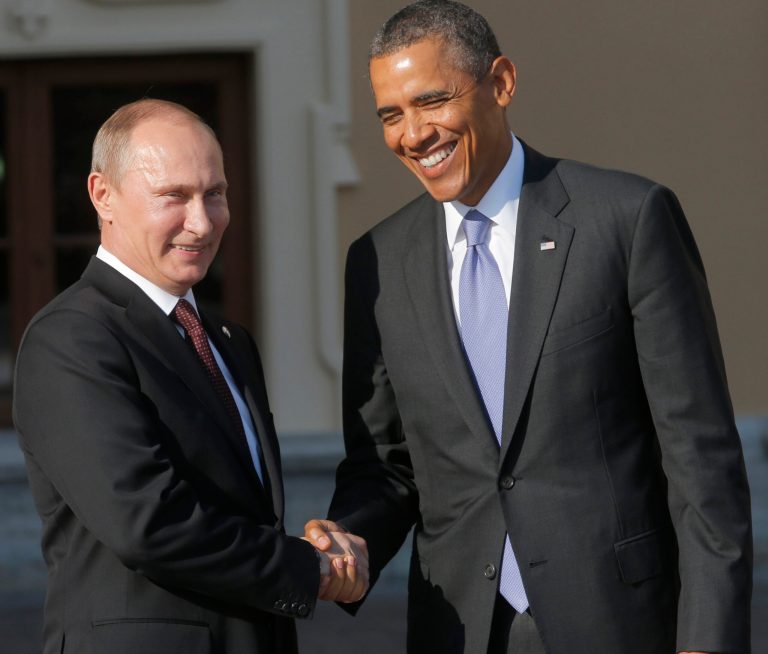 Russia's President Vladimir Putin, left, shakes hands with U.S. President Obama during arrivals for the G-20 summit at the Konstantin Palace in St. Petersburg, Russia. (AP Photo/Dmitry Lovetsky)