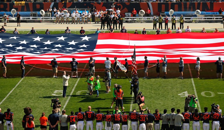 The Pittsburgh Steelers side of the field is nearly empty during the playing of the national anthem before an NFL football game between the Steelers and Chicago Bears, Sunday, Sept. 24, 2017, in Chicago. The Pittsburgh Steelers players did not come out to the field during the anthem. (AP Photo/Kiichiro Sato)