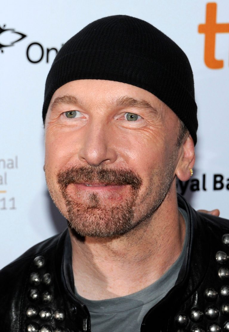 FILE - In this Sept. 8, 2011 file photo, U2 guitarist The Edge, whose given name is David Evans, attends an opening at the Toronto International Film Festival in Toronto. The California Coastal Commission has postponed on Wednesday, Oct. 8, 2014 a vote on a long-planned proposal by U2 guitarist The Edge and others to build five mansions in the mountains above Malibu. (AP Photo/Evan Agostini, File)