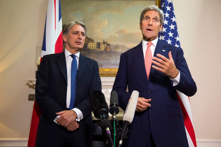 US Secretary of State John Kerry, right, and British Foreign Secretary Philip Hammond arrive for a news conference following a meeting about the ongoing crisis in Syria, on Saturday, Sept. 19, 2015, in London. (AP Photo/Evan Vucci, Pool)