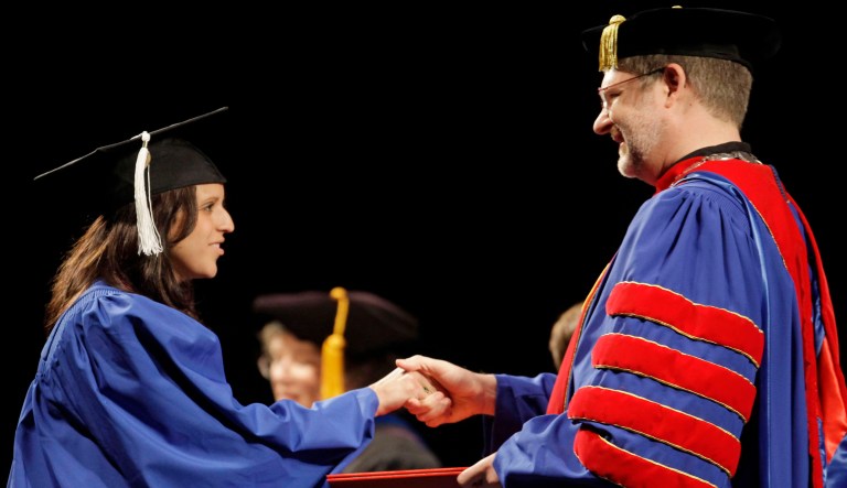 The new dilemma is a generation is being gated behind a four year wall which offers a diluted educational environment. (AP Photo/M. Spencer Green)