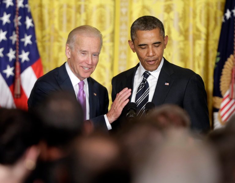 FILE - In this June 13, 2013, file photo, Vice President Joe Biden, left, pats President Barack Obama, right, on the chest while he speaks at a reception in the East Room of the White House in Washington to celebrate lesbian, gay, bisexual, and transgender pride month. Moments after the Senate passed a historic measure to outlaw workplace discrimination against gays on Nov. 7, 2013, activists turned their attention toward Obama and a long-sought executive order that would have the same effect, though on a much smaller scale.  (AP Photo/Pablo Martinez Monsivais, File)