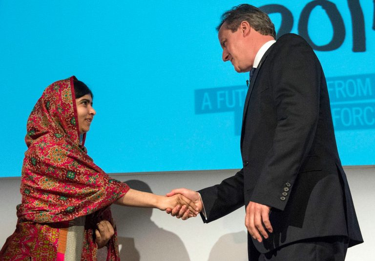 International women's rights advocate Malala Yousafzai and British Prime Minister David Cameron at the Girl Summit 2014 in London Tuesday. The summit, put on by the British government and UNICEF, brought together community leaders, governments, international organisations and the private sector to rally a global movement to end female genital mutilation and child, early and forced marriage in a generation. (Rex Features via AP Images)