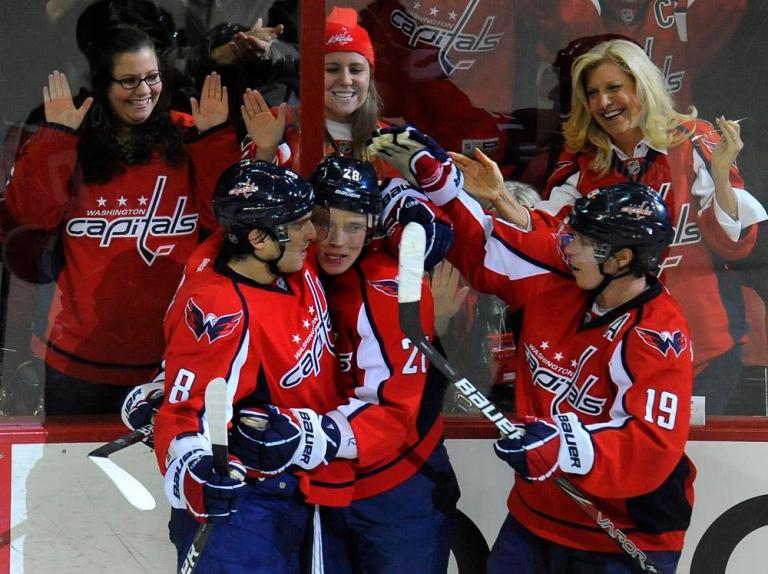 Washington Capitals' Alexander Semin, center, of Russia, is congratulated by teammates Alex Ovechkin (8) of Russia, and Nicklas Backstrom (19) of Sweden, after he scored his second goal of the game against the New York Rangers during third period of their NHL hockey game, Wednesday, Dec. 28, 2011, in Washington. Capitals defeated the Rangers 4-1.
