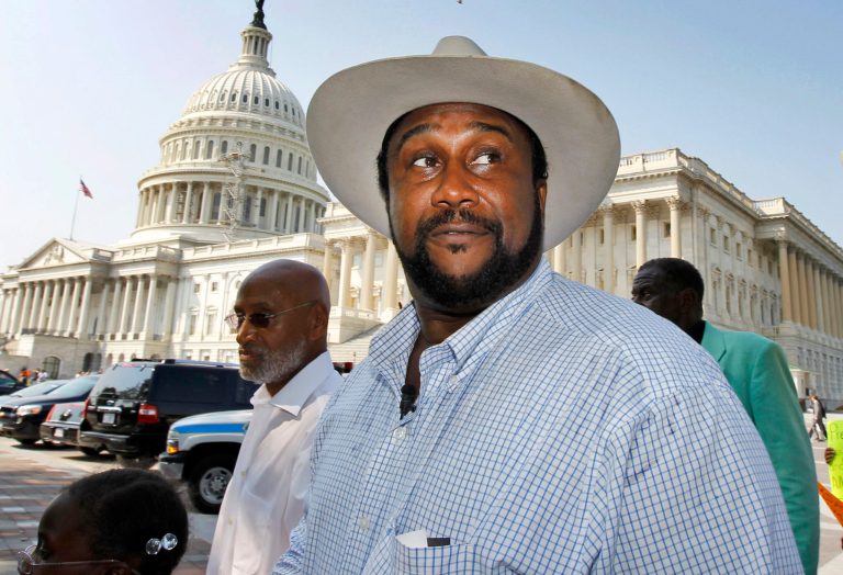 In this Sept. 23, 2010, file photo, John W. Boyd Jr., founder and president of the National Black Farmers Association, walks to a news conference on Capitol Hill in Washington. Boyd said he is owed $8 million for lobbying Congress to fund a $3.4 billion government settlement with Native American landowners who were swindled out of royalties.