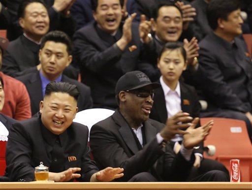 North Korean leader Kim Jong Un, left, and former NBA star Dennis Rodman watch North Korean and U.S. players in an exhibition basketball game at an arena in Pyongyang, North Korea. (AP Photo/VICE Media, Jason Mojica)
