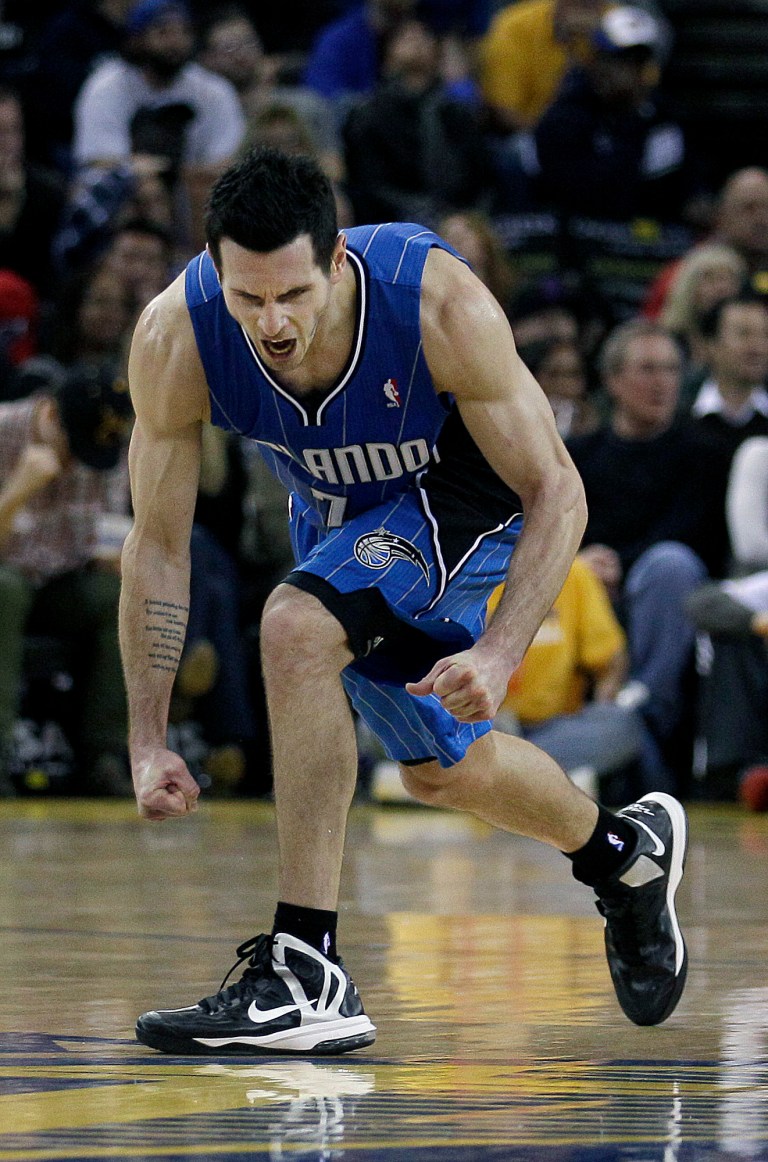  Orlando Magic shooting guard J.J. Redick (7) celebrates after the Magic scored against the Golden State Warriors during the fourth quarter of an NBA basketball game in Oakland, Calif., Monday, Dec. 3, 2012. The Magic won 102-94. (AP Photo/Jeff Chiu)  