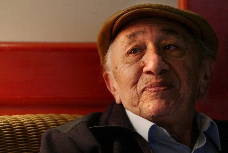 FILE - In this April 19, 2005 file photo,Venezuelan folk musician Simon Diaz listens during an interview in New York. According to his daughter Bettsimar Diaz, the 85-year-old musician, actor and director died after a long undisclosed illness in Caracas, Venezuela, Wednesday, Feb. 19, 2014. (AP Photo/Bebeto Matthews, File)