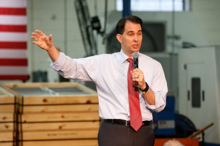 Scott Walker's proposal lays out many more specifics for how the tax credits would work than Marco Rubio's. (AP Photo)Â 