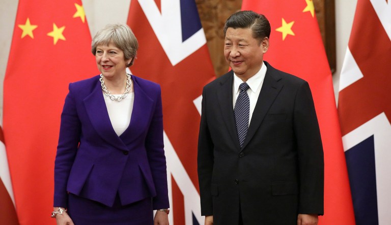 British Prime Minister Theresa May, left, and Chinese President Xi Jinping pose for a photo prior to a Thursday meeting in Beijing. May met Xi on a visit aimed at mapping out a new trading arrangements following Britain's departure from the European Union. (Wu Hong/Pool Photo via AP)
