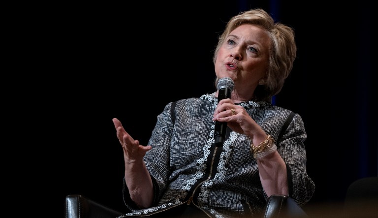 Clinton's tweets don't offer any new arguments, conclusions, or revelations. Her opportunism doesn't help law-enforcement, inform lawmakers, or comfort victims. (AP Photo/Craig Ruttle)