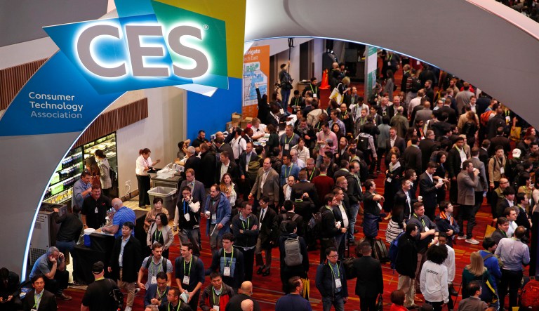 People attend CES International, Tuesday, Jan. 9, 2018, in Las Vegas. (AP Photo/John Locher)