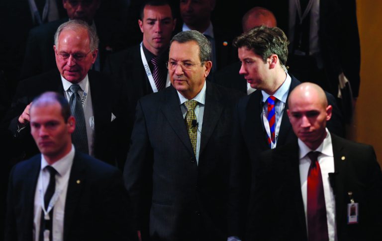 Israeli Defense Minister Ehud Barak, center, arrives for a meeting of the Security Conference in Munich, southern Germany, on Sunday, Feb. 3, 2013. The 49th Munich Security Conference started Friday until Sunday with experts from 90 delegations. (AP Photo/Matthias Schrader)