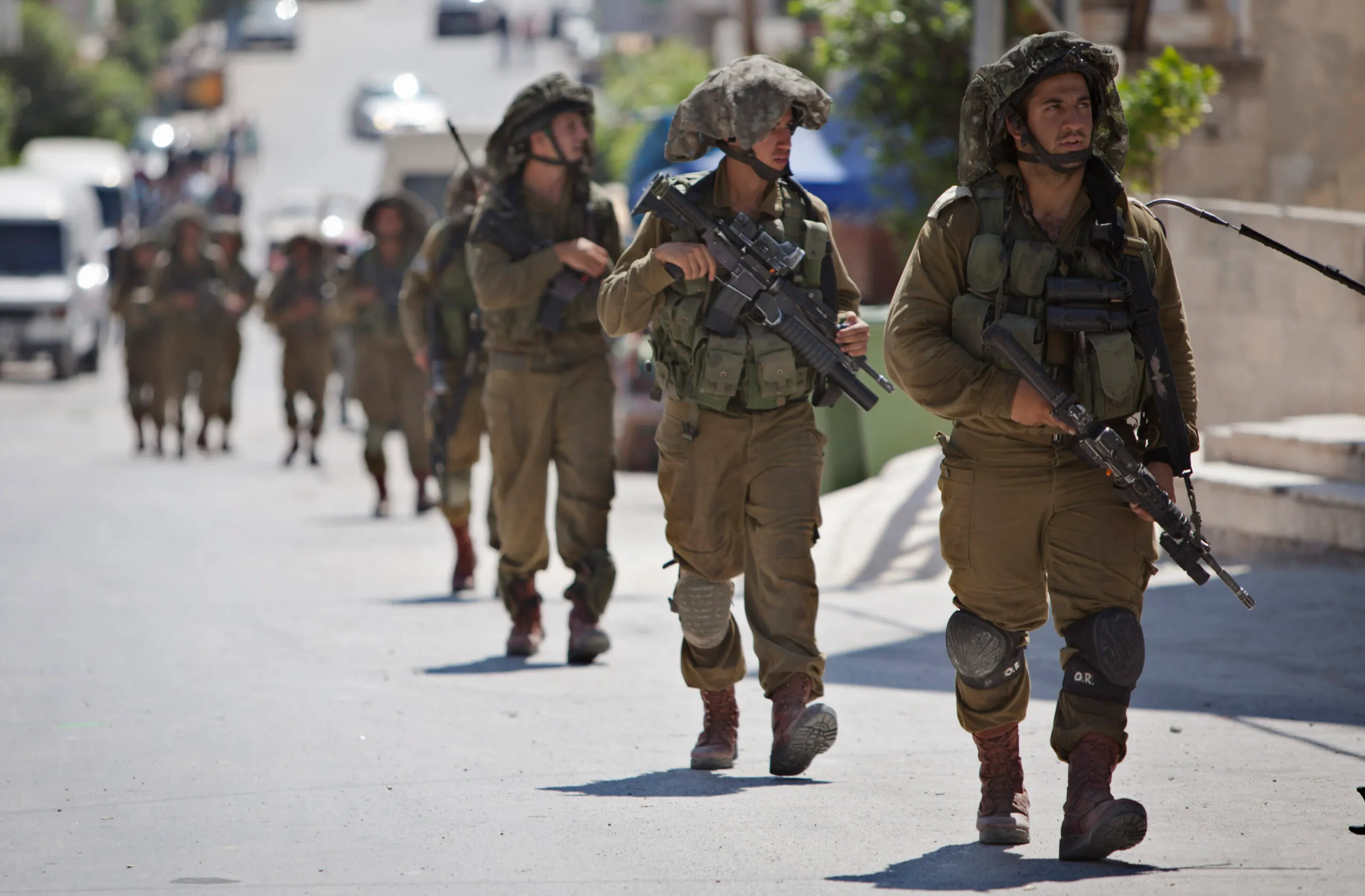 Palestinian leader defends cooperation with Israel