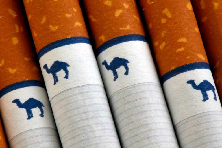 FILE - This Oct. 21, 2009 file photo shows Camel cigarettes, a Reynolds American brand, in Philadelphia. Reynolds American reports quarterly earnings on Wednesday, April 23, 2014. (AP Photo/Matt Rourke, File)