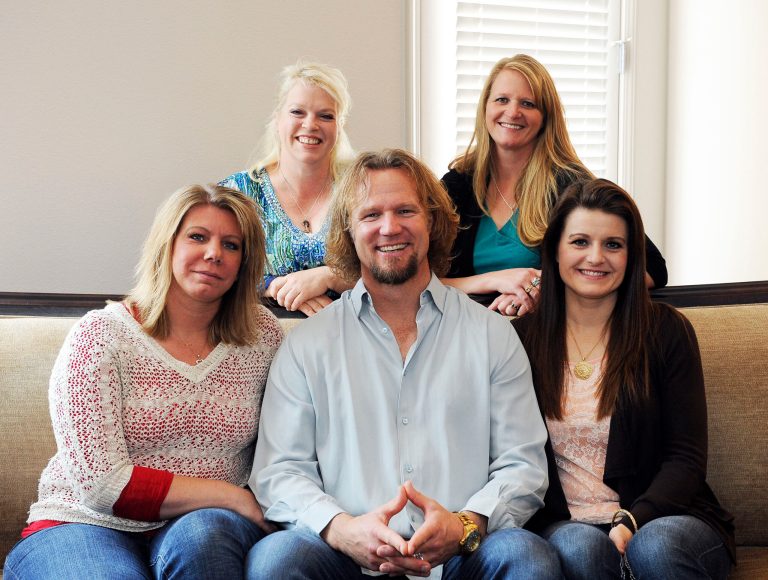 Kody Brown poses in 2013 with his wives at one of their homes in Las Vegas. (AP Photo/Las Vegas Review-Journal, Jerry Henkel, File)
