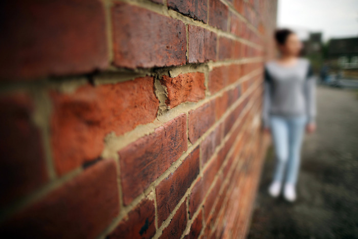 A teenage girl, who claims to be a victim of sexual abuse and alleged grooming, poses in Rotherham on September 3, 2014 in Rotherham, England. (Christopher Furlong/Getty Images)