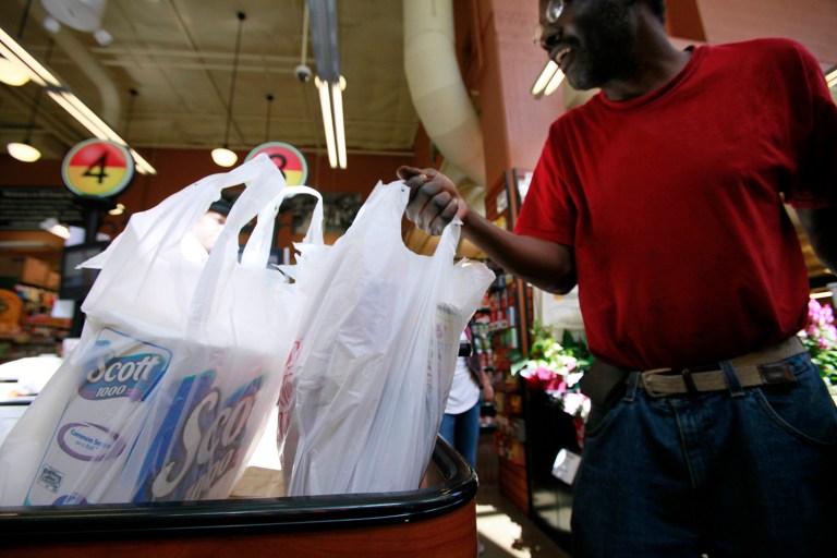 Being able to get the large corporations on board with bag taxes would be a huge coup for environmentalists. Considering that the law benefits big retailers to the tune of $300 million, it wasn't too difficult. (AP Photo)