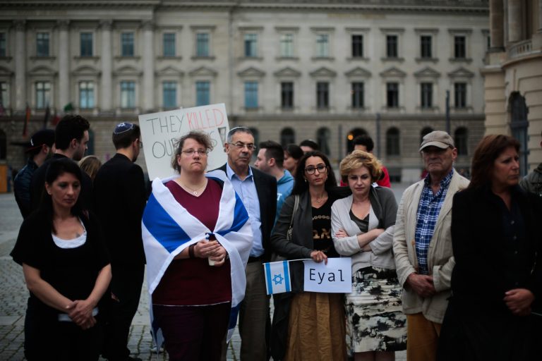 Mourners attend a commemoration for three missing Israeli teenagers whose bodies were found by the Israeli military on Monday, just over two weeks after they went missing in the West Bank, at Bebel Place in Berlin. (AP Photo/Markus Schreiber)