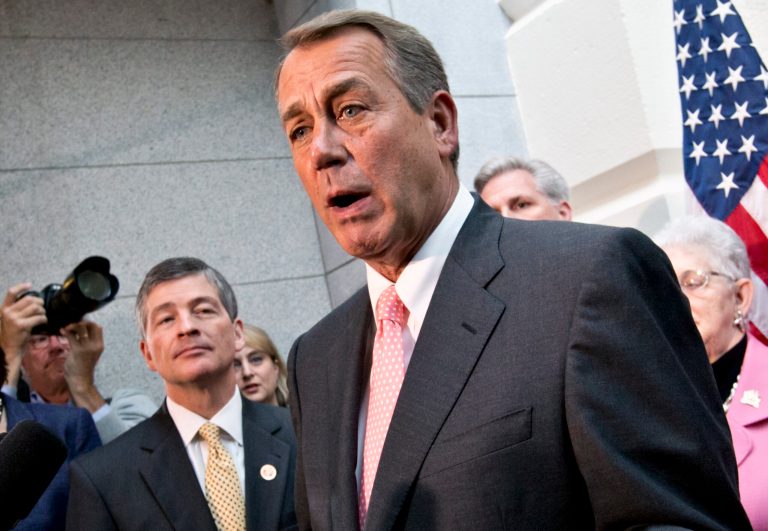 House Financial Service Committee Chairman Rep. Jeb Hensarling, left, listens as House Speaker John Boehner of Ohio speaks during a news conference on Capitol Hill. (AP Photo/J. Scott Applewhite, File)