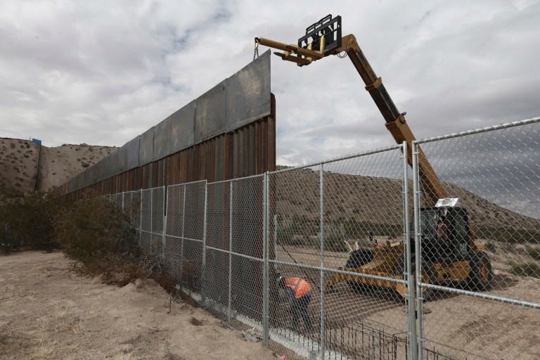 Taxing remittances might provide enough money to fund lower-end cost estimates for the wall. (AP Photo/Christian Torres)