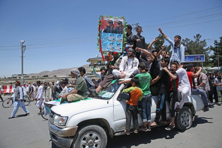 Supporters of presidential candidate Abdullah Abdullah shout slogans during a protest in Kabul, Afghanistan, Saturday, June 21, 2014. Former Foreign Minister Abdullah, who is running against Ashraf Ghani Ahmadzai, a former finance minister, has accused electoral officials and others of trying to rig the June 14 vote against him. (AP Photo/Massoud Hossaini)