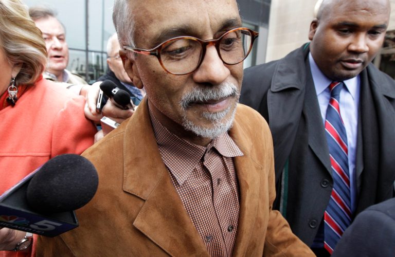   Illinois State State Sen. Donne Trotter leaves the Cook County Courthouse after posting bond Thursday, Dec. 6, 2012 in Chicago. Trotter was charged Wednesday, Dec. 6, 2012 with a felony count for allegedly trying to board a flight at O'Hare International Airport with a weapon and ammunition in a carry-on bag. (AP Photo/M. Spencer Green)  