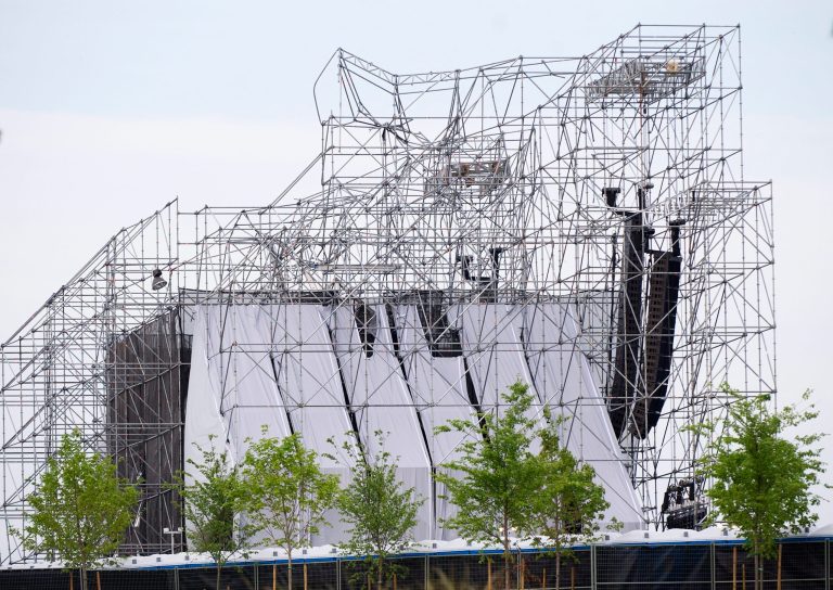   A stage intended for a Radiohead concert is collapsed at Downsview Park in Toronto on Saturday, June 16, 2012. Toronto paramedics say one person is dead and another is seriously hurt after the stage collapsed while setting up for a Radiohead concert. They say two other people were injured and are being assessed. (AP Photo/The Canadian Press, Nathan Denette)  