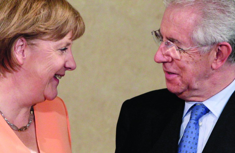 FILE - In this July 4, 2012 file picture German Chancellor Angela Merkel, left, talks with Italian Premier Mario Monti during a bilateral meeting at Villa Madama in Rome. The German and Italian leaders have pledged to do everything to protect the eurozone, their governments said Sunday July 29, 2012 - further underlining European politicians' determination to get a grip on the continent's debt crisis, but again offering no details of any action. Chancellor Angela Merkel and Premier Mario Monti spoke by phone Saturday and 