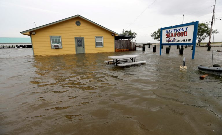 The Bayfront Seafood restaurant is surrounded by floodwaters in the aftermath of Hurricane Harvey Saturday, Aug. 26, 2017, in Palacios, Texas. (AP Photo/David J. Phillip)
