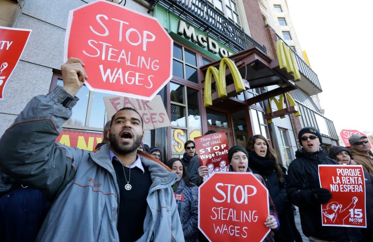 Studies have shown that raising the overtime pay ceiling will generally not raise workers' total pay. Instead, employers will pay a lower base salary so that the total pay packet is about the same. (AP Photo/Steven Senne)