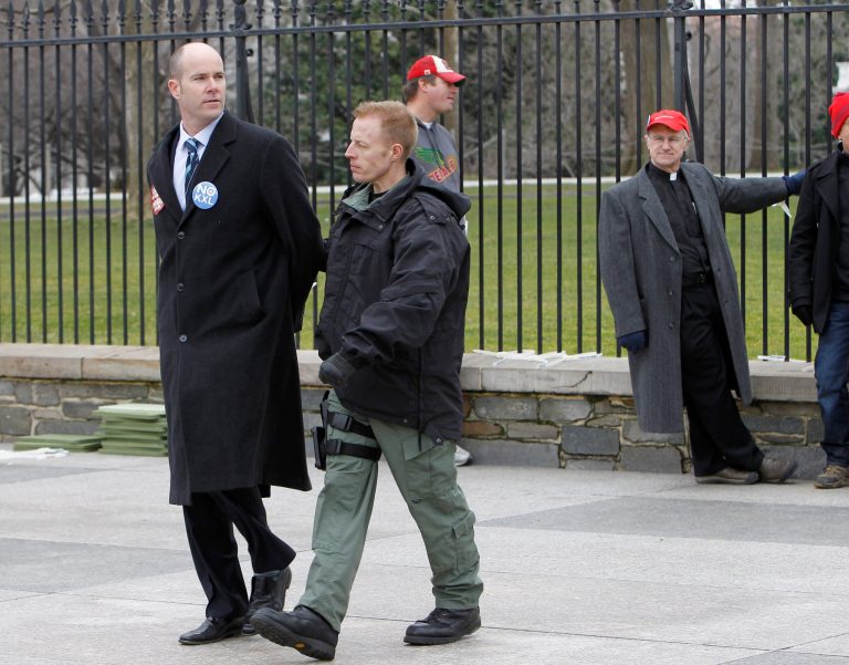 FILE - This Feb. 13, 2013 file photo shows Sierra Club Executive Director Michael Brune being arrested outside the White House in Washington, as prominent environmental leaders tied themselves to the White House gate to protest the Keystone XL oil pipeline. President Barack Obama is sticking to a fossil-fuel dependent energy policy, delivering a blow to a monthslong, behind-the-scenes effort by nearly every major environmental group to convince the White House that the policy is at odds with his goals on global warming.  (AP Photo/Ann Heisenfelt, File)
