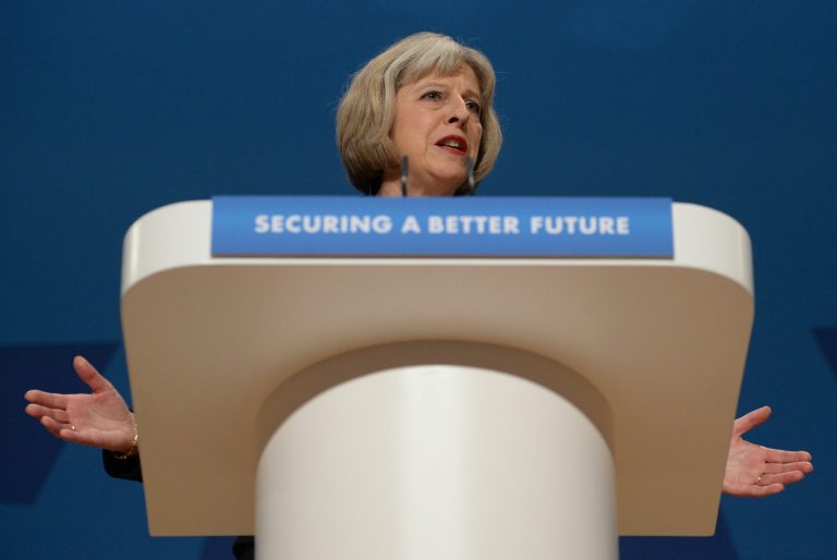 British Home Secretary Theresa May gives her speech to delegates at the Conservative Party annual conference in Birmingham, England, Tuesday, Sept. 30, 2014. Britain's interior minister says people with extremist views could be barred from appearing on television or publishing on social media even if they are not breaking any laws. Home Secretary Theresa May told a conference of the governing Conservatives that if re-elected next year the party will introduce powers to disrupt people who 