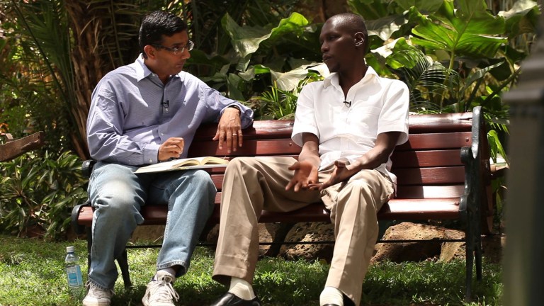 Dinesh D'Souza, left, interviews George Obama for the film 
