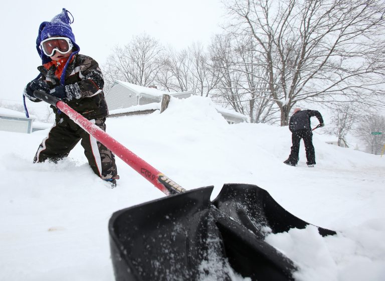 Bill Ford gets help shoveling the sidewalk by his 3-year-old son, Bray, during a winter storm that came through the area in Monona, Wis., Tuesday, March 5, 2013. (AP Photo/Wisconsin State Journal/Amber Arnold)