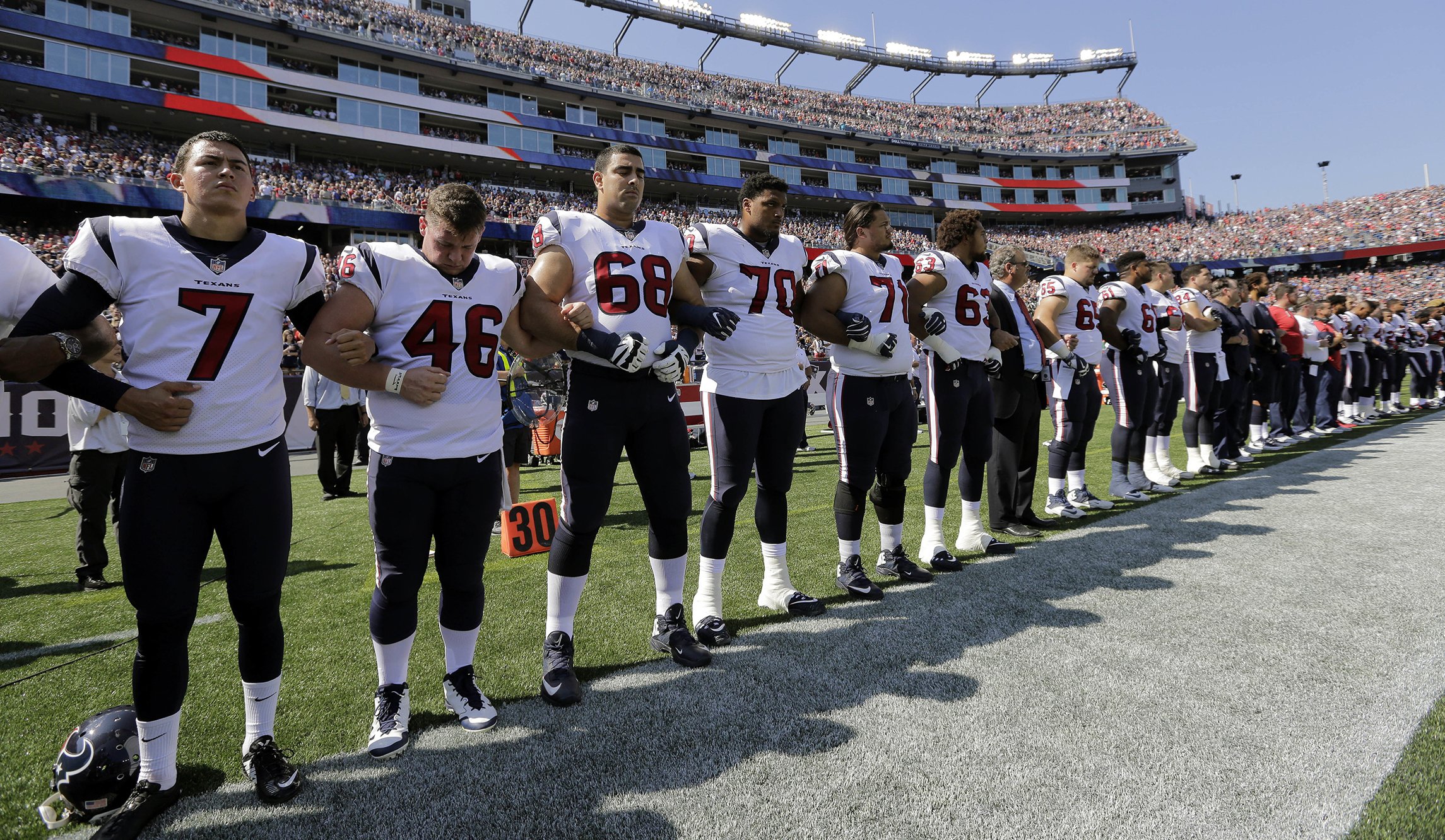 Trump takes credit for NFL players linking arms during the anthem in show of unity