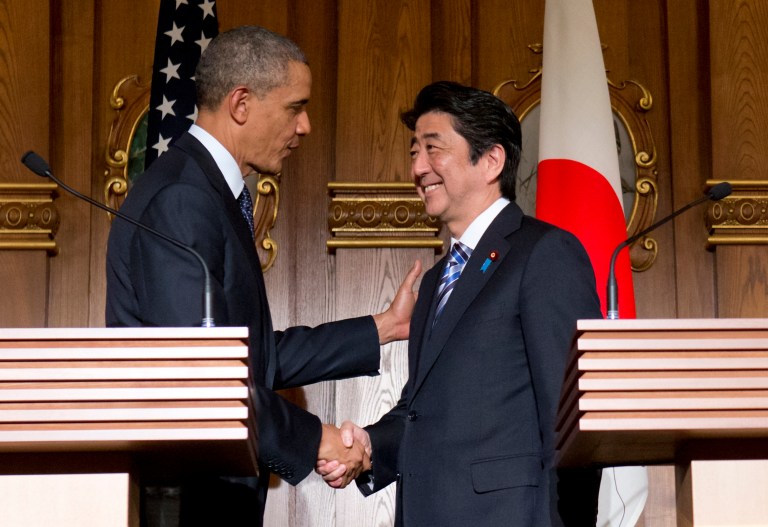 President Barack Obama, left, and Japanese Prime Minister Shinzo Abe shake hands at the conclusion of their joint news conference at the Akasaka State Guest House in Tokyo, Thursday, April 24, 2014. Obama said Thursday that he wants to see a dispute between China and Japan over islands in the East China Sea resolved peacefully, while affirming that America's mutual security treaty with Japan applies to the islands. (AP Photo/Carolyn Kaster)