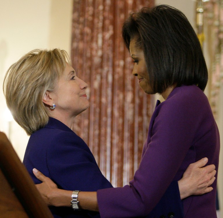 Secretary of State Hillary Rodham Clinton hugs first lady Michelle Obama at the International Women of Courage Award Ceremony at the State Department in Washington, Wednesday, March 11, 2009.(AP Photo/Alex Brandon)
