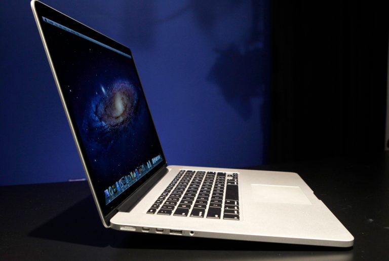   This Wednesday, June 13, 2012 photo shows a profile view of the new 15-inch MacBook Pro with Retina display, in New York. The new laptop features a display that has four times as many pixels as a standard display. The Retina MacBook starts at $2199, nearly three times as much as the average consumer spends on a laptop, but it isnât a bad price for the video editors, photographers and graphic designers who are the intended buyers. Compared to the regular MacBook model, itâs thinner, lighter and lacks a DVD drive. It even lacks an Ethernet port for Internet connections. (AP Photo/Kathy Willens)  
