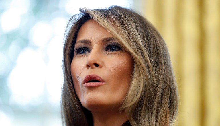 Melania Trump, the wife of US President Donald Trump, hands out Dr. Seuss books to patients at the Queen Fabiola Childrens Hospital in Brussels on Thursday, May 25, 2017. Melanie Trump visited children in a ward at the hospital on Thursday and participated in a crepe paper flower making workshop. (AP Photo/Virginia Mayo)